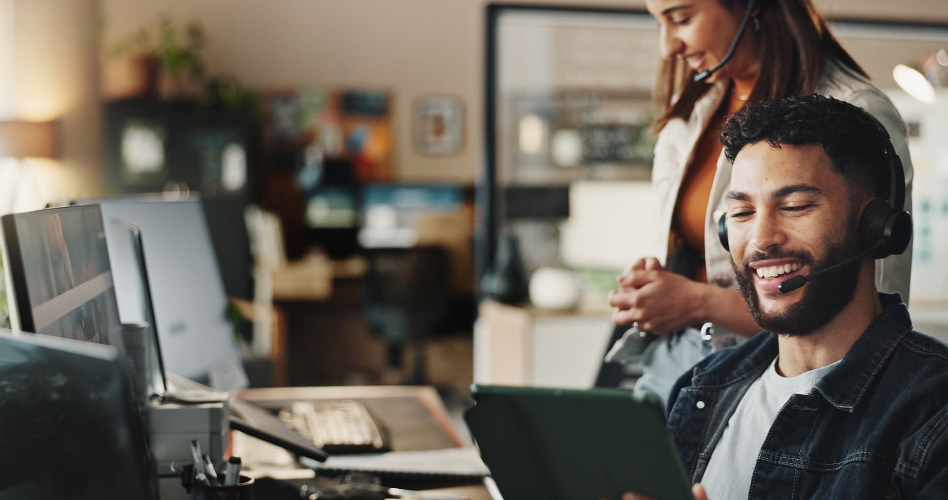 A smiling customer service worker on a call