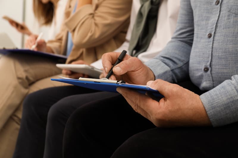 Close up of a person filling application for a job interview